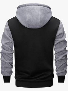 Rear view of outdoor hooded knit jacket featuring a black and grey color-block design