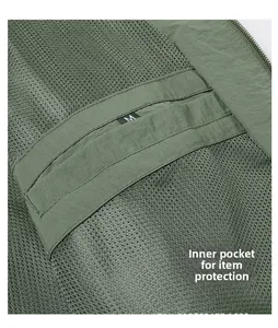 Detail view of military green jacket interior with mesh lining and a size M pocket