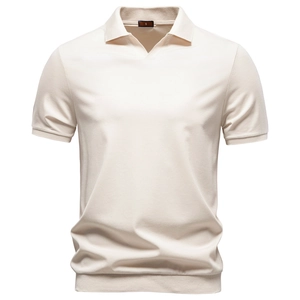 Detailed view of the V-neck Johnny collar and soft knit texture of the beige Polo shirt