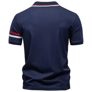 Rear view of navy blue men's polo shirt with red and white striped cuffs and collar detail
