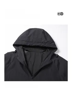 Detail of hooded windbreaker with breathable mesh lining and adjustable drawstrings