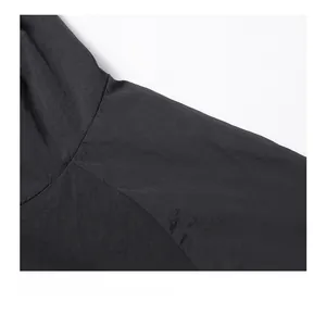 Detailed close-up showing the precise stitching and durable matte nylon fabric on the jacket