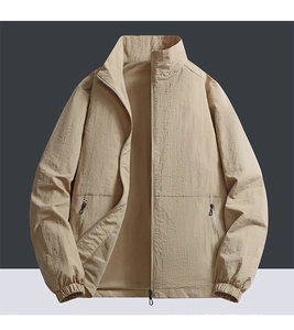 Detail view of khaki bomber jacket featuring breathable mesh lining and inner structure