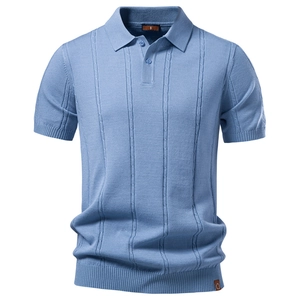 Close-up of light blue knit polo shirt showing textured vertical patterns and small label