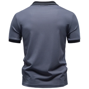Detail view of the back of a greyish blue Tencel Polo shirt with ribbed collar and cuffs