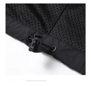 Detail shot of men's windbreaker hem with adjustable drawstring and mesh lining