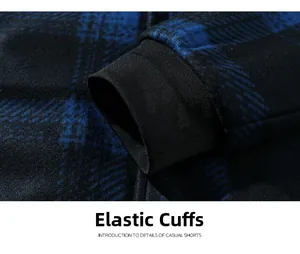 Close-up of elastic ribbed cuffs on a thick dark blue plaid fleece jacket