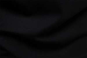 Macro shot of black Tencel fabric texture with fine twill weave for polo shirts