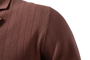 Macro detail of brown knit polo shirt showing vertical stripe texture and shoulder seams
