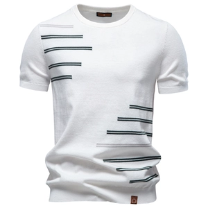 Detail of white cotton knitted T-shirt featuring asymmetrical grey stripes and leather hem tag
