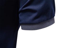 Detail of navy piqué fabric and grey ribbed cuffs on high-quality short sleeve Polo shirt