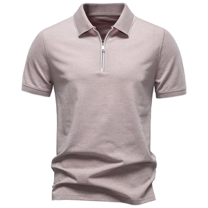 Detail of light brown waffle knit polo shirt with metal zipper and white contrast trim