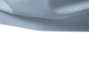 Detailed close-up of light blue Tencel Polo shirt hem with precision double stitching