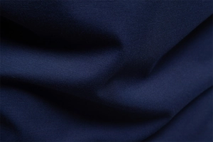 Detailed close-up of dark blue jacquard texture on men's Tencel polo shirt fabric