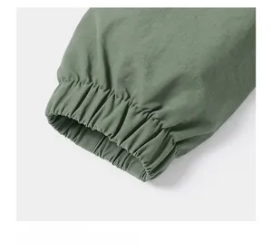 Close-up of military green elastic cuffs on a lightweight bomber jacket for men