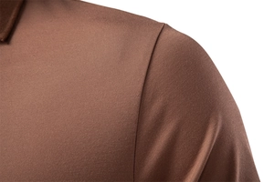Macro detail of caramel brown Tencel fabric and precise shoulder seam on men's polo shirt