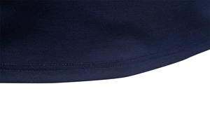 Detail shot of navy blue polo shirt hem featuring professional double-needle stitching