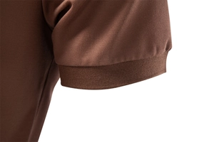 Detail of brown tencel polo shirt sleeve with ribbed cuff and pique knit texture