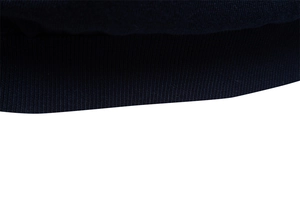 Macro shot of navy blue ribbed knit texture on a cotton T-shirt cuff and hemline
