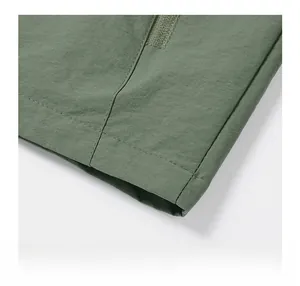 Detail of military green flight jacket featuring durable fabric and velcro closure