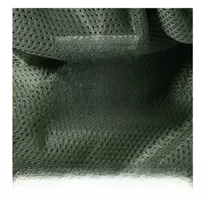 Detail of bomber jacket lining showing 100% nylon fabric and white care label information