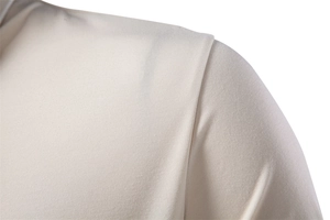 Close-up of fine stitching and premium fabric texture on light beige men's polo shirt collar