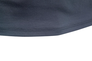 Close-up of high-quality charcoal gray jacquard fabric with durable double-stitch hem