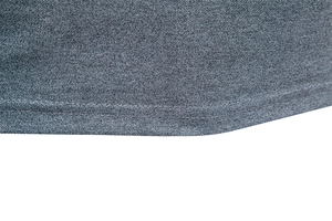 Macro detail of men's polo shirt hem with grey pique knit fabric and double stitching