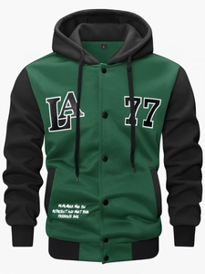 Detail of forest green baseball jacket featuring LA print and snap button closure