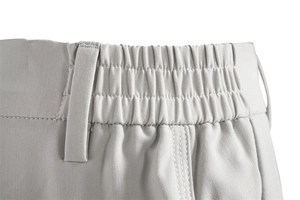 Detail of light gray casual trousers featuring an elastic waistband and twill texture