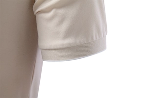 Detailed macro view of the tencel polo shirt sleeve with ribbed cuffs and white tipping