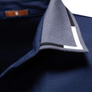 Men's navy tencel polo shirt featuring textured jacquard fabric and striped collar detail