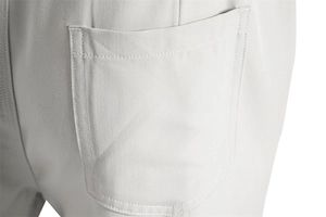 Macro shot of back patch pocket on men's casual twill pants with double-needle stitching