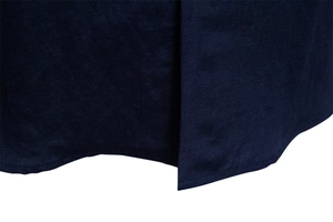 Detailed close-up of navy blue shirt curved hem with premium linen texture and stitching