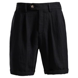 Detail view of black lyocell cotton shorts with double pleats and fixed rolled cuffs