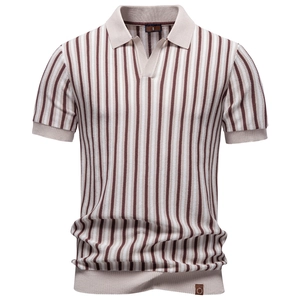 Detailed texture of brown and beige striped knit polo shirt with ribbed cuffs and hem