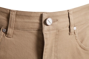 Close-up of khaki cotton twill pants waist with fashion metal button and stitching