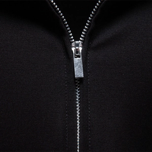 Men's black tencel short sleeve polo shirt with silver metal zipper detail view