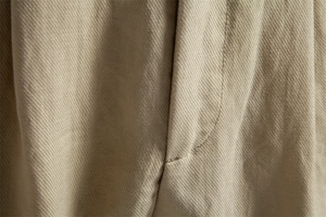 Detail of khaki twill fabric and premium stitching on men business casual shorts