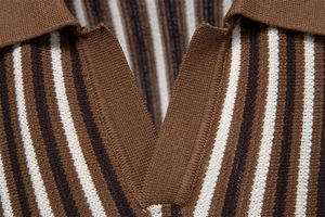 Macro shot of striped knit polo neckline featuring brown and cream vertical patterns