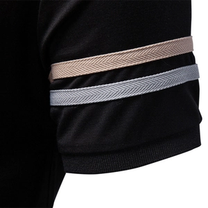 Men's black Tencel polo shirt featuring ribbed cuffs and herringbone striped details