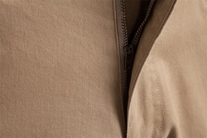 Macro detail of high-quality YKK metal zipper and premium khaki twill cotton fabric on trousers