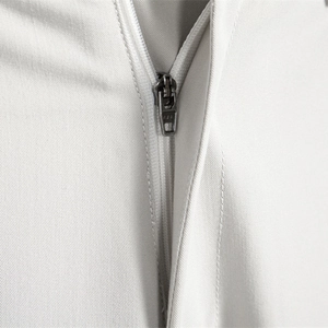 Men's casual pants detail showing high-quality YKK metal zipper on twill fabric