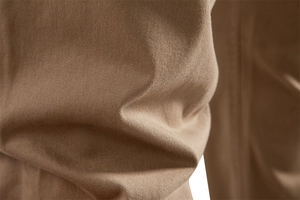 Close-up of khaki cotton twill fabric texture showing high-quality diagonal weave pattern