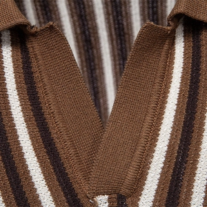Close-up of stylish striped knit polo shirt with premium textured fabric and classic collar