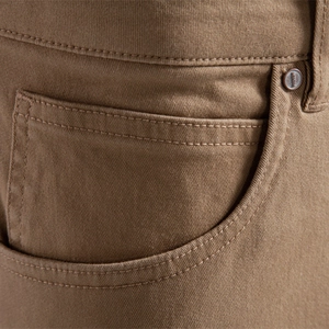Men's khaki cotton casual pants featuring durable twill fabric and reinforced metal rivets