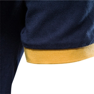 Men's navy cotton polo shirt with yellow ribbed cuffs and breathable pique texture