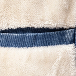 Men's winter denim jacket featuring blue twill fabric and warm white fleece lining
