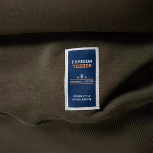 Men's loose military green sweatshirt featuring a premium blue woven fashion label detail