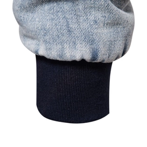 Men's denim jacket with fleece lining featuring snow wash texture and ribbed cuffs